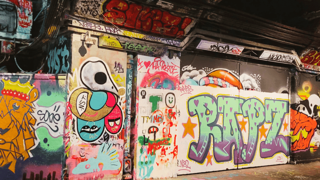 Shot of a tunnel full of graffiti. 